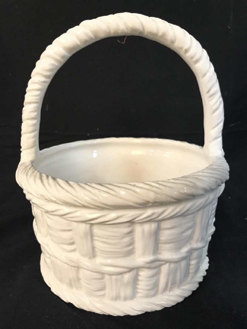 White Toned Italian Porcelain Basket: Underside reads MADE IN ITALY. Piece is white toned and has handle. Porcelain basket, Italian Porcelain. Measures approx 10 inches tall 8.5 inches wide. tableware, tabletop accessory, decor piece, dec