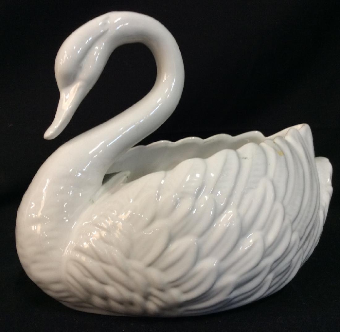 White Toned Porcelain Swan Centerpiece: White Toned Porcelain Swan Centerpiece. Centerpiece, CACHÉ Pot, planter, tableware tabletop accessory. Marked on underside with F stamp, rest illegible. Some crazing and surface wear. Measures App 10