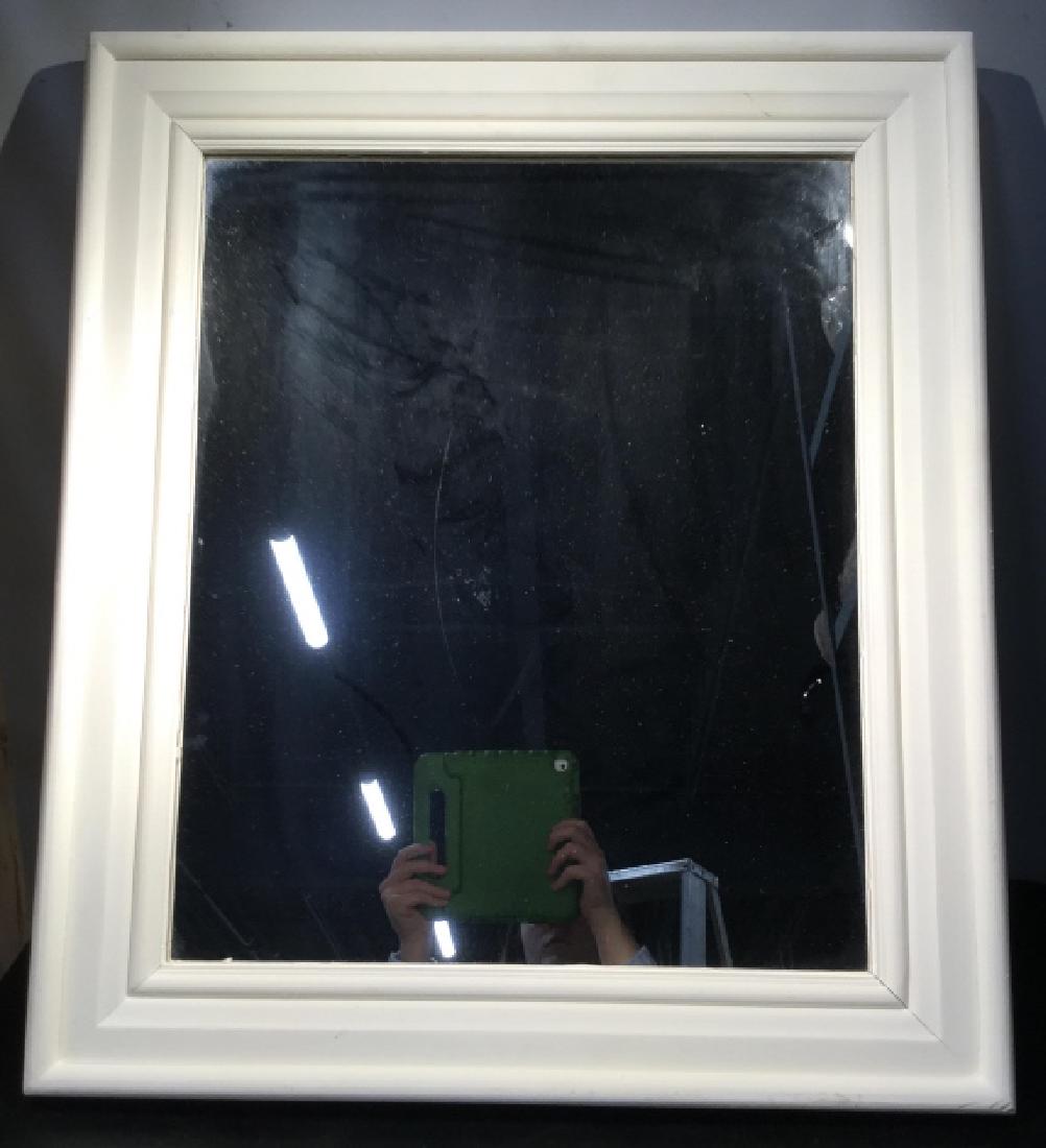Mirror in Painted White Wood Frame: Mirror in painted white wood frame. Mirror measures approx 27.75 inches in height by 24 inches in width. Some minor blemishes on frame. Rustic country cottage interior decor, country chic, shabby chic