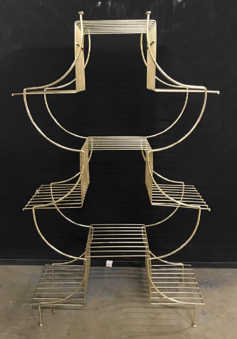 Brass Toned Metal Plant Stand: Brass Toned Metal Plant Stand with six tiers, measures approx 37.5 inches tall x 22 inches wide x 9 inches deep, some pitting to metal. Plant Stand, Display Stand, Metal Stand. 2