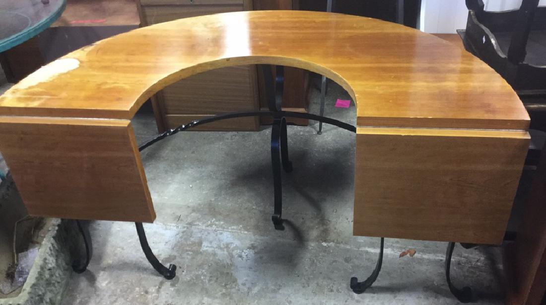 Vintage Drop Leaf Hunt Table Desk: Crescent shaped, horseshoe shaped wood hunt table featuring 2 drop-leaf sides and iron legs. With twist and scrolling. Measures approx 29 inches H x 56 inches W x 32 inches D (not including 12 inch le
