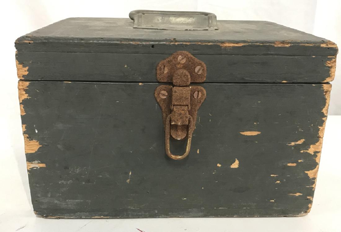 Vintage Wooden Utility Box: Vintage, possibly antique, wooden utility box. Box is painted sage green. Silver tone metal top handle, along with rusted metal clasp closure. Due to age, box has surface wear of wood and metal, inclu