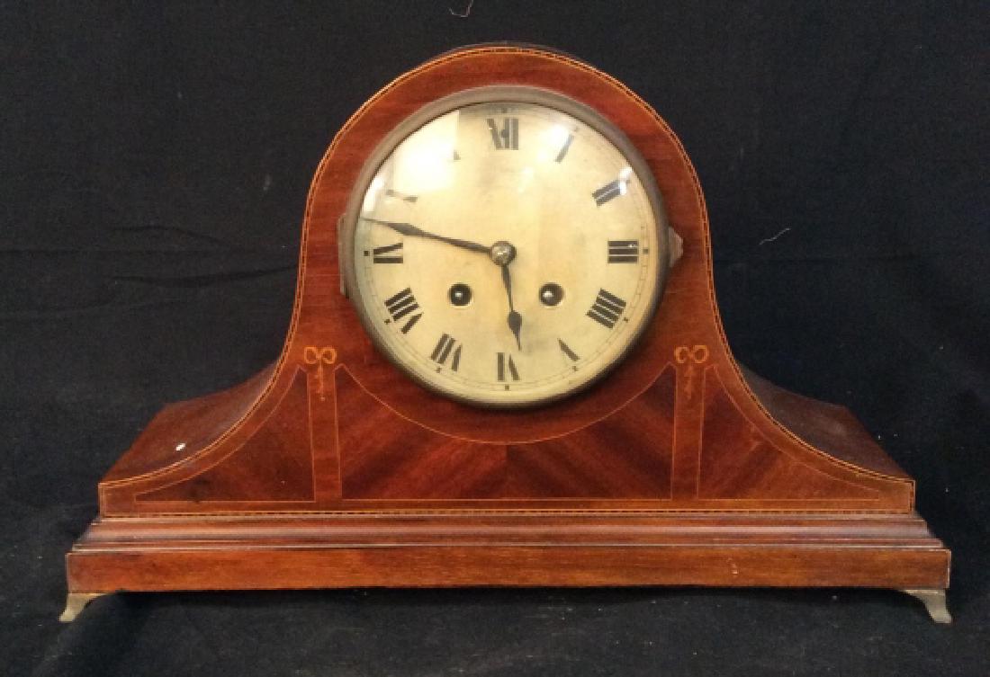 Inlaid Tambor Style Mantle Clock: Brass feet, inlaid border and design detail, Mantle Clock, measures app ht 10 inches length app 16 inches, depth app 6 inches Mantle clock, home accessory, decor piece, collectible clock.