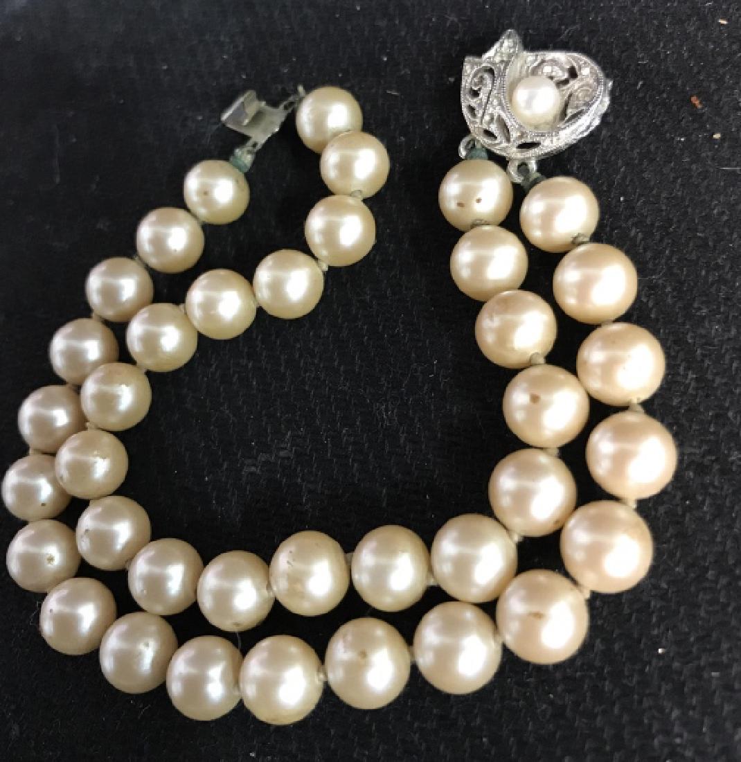 Vintage Pearl bracelet with fish clasp: Vintage Pearl bracelet with clasp fashioned as a circling fish with a faux pearl and faux diamonds, good condition, 7 in long, vintage faux pearls collectibles, Ladies Costume Jewelry, Ladies Collecti