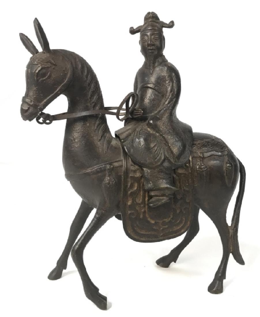 Bronze Asian Figure On Horseback Statue Censer: Vintage/Antique Bronze Asian Figure On Horseback Statue Vessel, Figure can be removed to reveal hidden storage compartment, measures approx 9 inches tall x 7 inches long x 2.75 inches wide. Orientalis