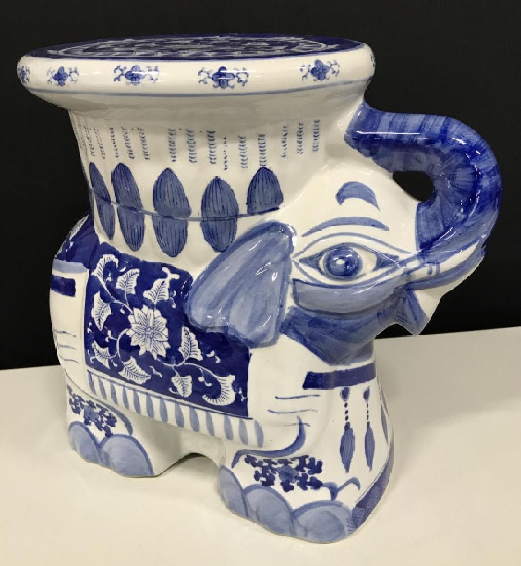 Blue And White Porcelain Ceramic Elephant: Blue And White Porcelain Ceramic Elephant, Plant Stand, Stool. A white ceramic plant stand in the form of an elephant, with a flat top, and intricate hand painted blue design. Marked on underside Made
