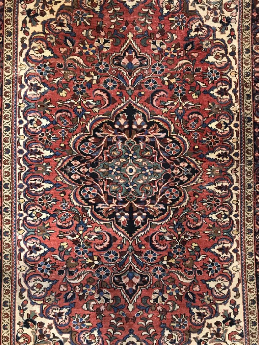 Vintage Handmade Multi Toned Wool Rug: Rug is vintage and handmade. Contains multi toned floral vine and leaf detail with tones of navy, cream, red, pink, brown and green. Contains some wear. Area rug, area carpet, handmade rug, vintage ha