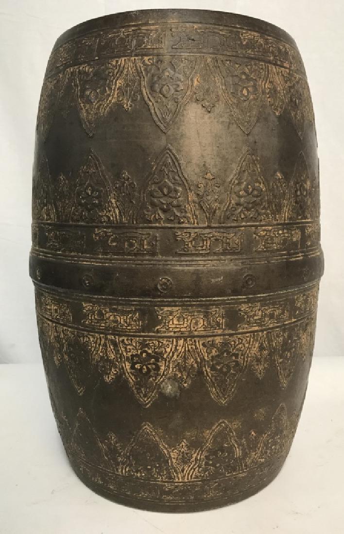 Metal Drum W Embossed Dragon & Floral Pattern: Vintage, possibly antique, metal drum with embossed dragon symbol and floral banded pattern. Metal is possibly steel with deep brown tone coating. Possibly Southeast Asian or middle Eastern in origin.