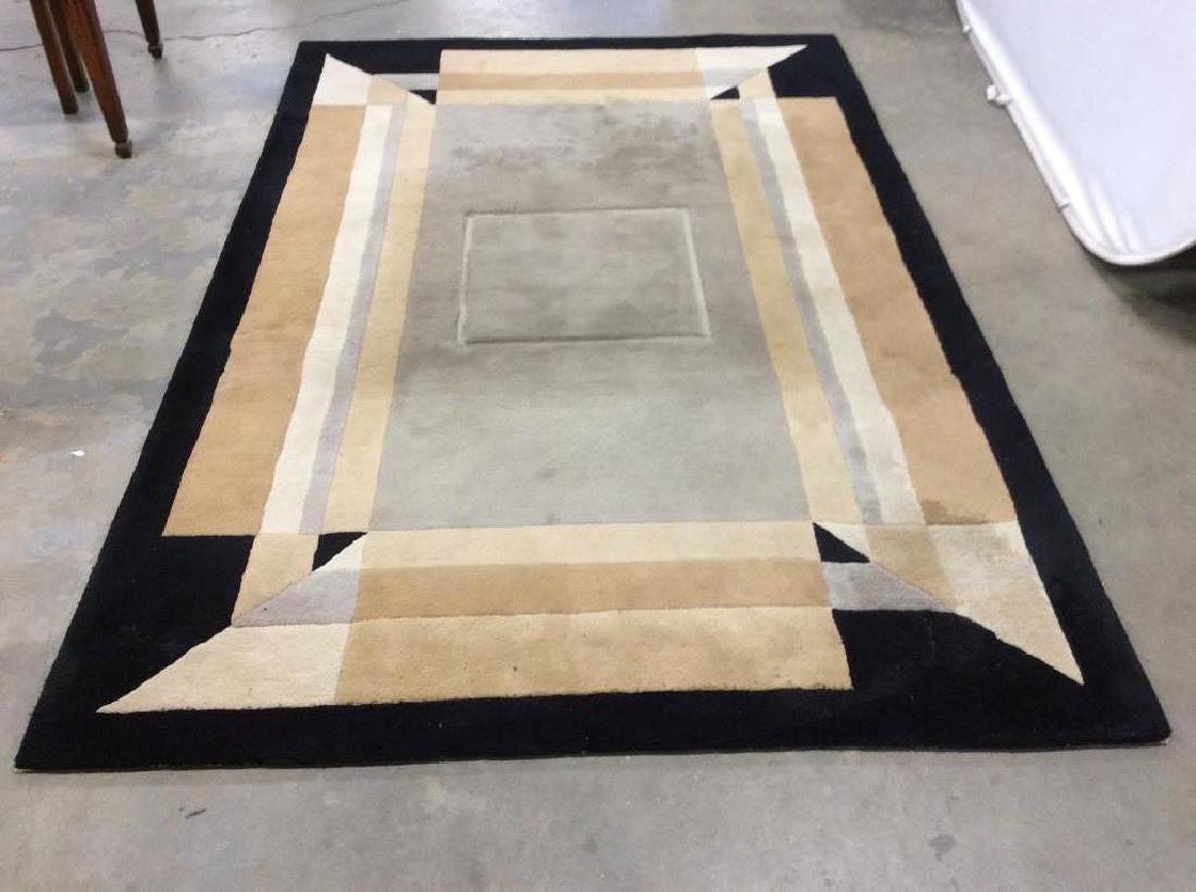 SHYAM AHUJA Handmade Woolen Carpet: Tag on underside reads SHYAM AHUJA ATHENS HANDMADE IN INDIA. Measures approx 5’6 by 8’6. Piece has tones of black, grey, beige & tan. Area rug, area carpet, handmade rug, Handmade carpet. Has noti