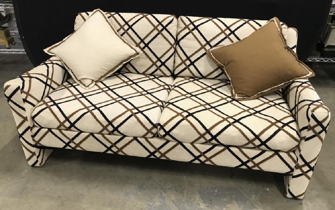 Selig Mid Century Modern Upholstered Sofa: MId Century Modern Upholstered Sofa by Selig with beige base and black and brown criss cross design, measures approximately 56 inches long x 33 inches deep x 26 inches tall, small pulls to back of cou