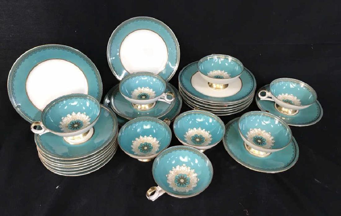 Set Kerbel Jacob , German Porcelain Dessert Set: Bright turquoise and gold porcelain table ware, marked and signed Kerbel Jacob, Bavaria, Germany, with leaping Stag Trademark, set includes 10 saucers, 8 footed cups, and 10 dessert plates diameter ap