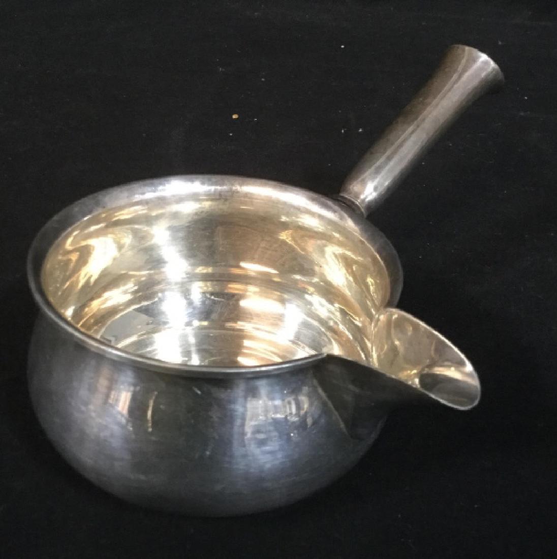 Signed Trademarked Sterling Silver Sauce Boat: Ladle Sterling silver cup and handle, Tableware, Measures ht app 3.5 inches, rim to handle measures app 8.25 inches, sterling silver table top accessory, utensil, marked underside for Sterling and ini