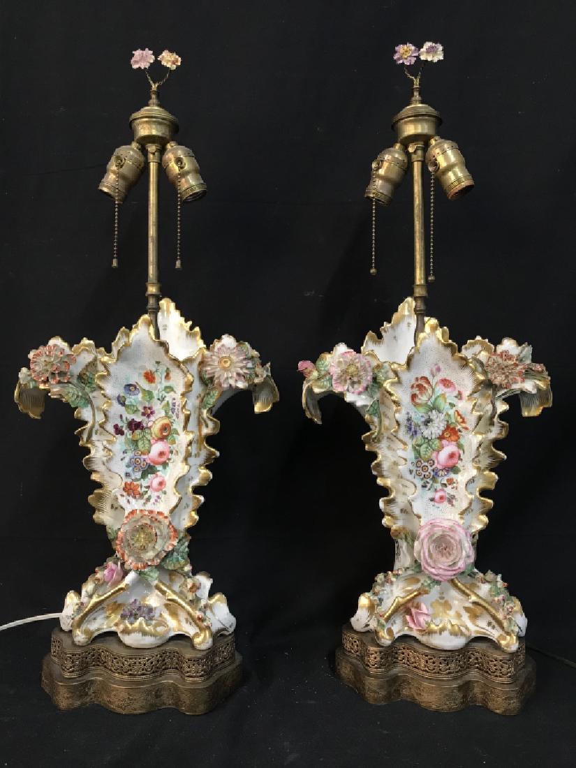 Pair Antique Dresden Style Porcelain Table Lamps: Pair Antique Dresden Style Porcelain Table Lamps with raised rosettes, floral and leaf details, Hand Painted multicolored floral and leaf design and gold tone painted accents, lamps rest on two tiered