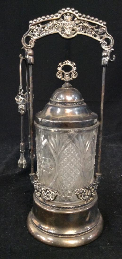 Antique Silver Glass Pickle Caster: Cut Glass Cylindrical Vessel inset to Silver Plate Base, Silver Plate Lid, And Detailed Silver Plate crown handle, Side Holder comes with talon foot Designed Tongs, Collectible Tableware, pickle jar,