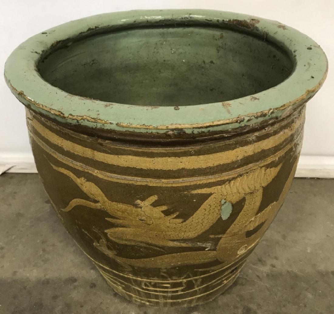Chinese Oversized Antique Planter W Dragon Motif: Oversized outdoor antique garden planter with Chinese Dragon motif. Possibly late 19th century. Chinese clay earthenware planter originally used to transport and display eggs. Planter is muted brown, 