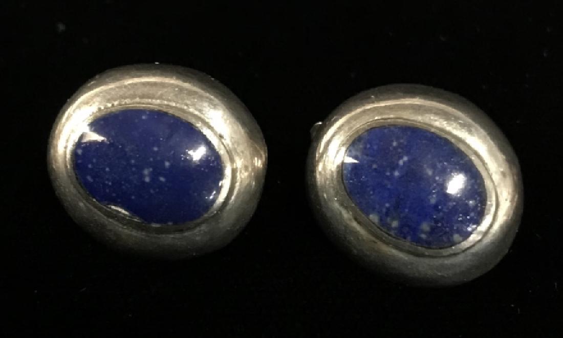 Pair of Sterling Silver Blue Tanzanite Earrings: Royal blue center stones inset to sterling silver casings Marked 925, vintage jewelry, estate jewelry, each measures app .5 inches