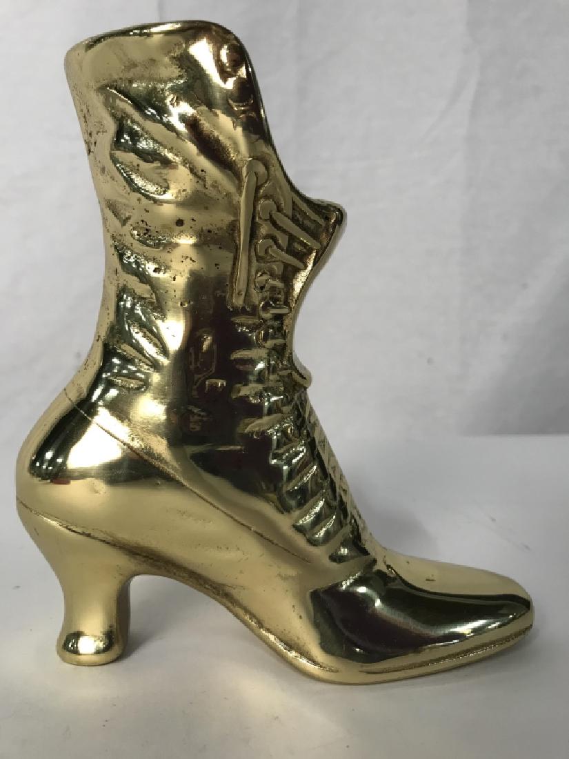 Polished Brass Metal Victorian Shoe Vase: Vase, vessel,Tableware, collectible, bright brass Gold in tone, lace up shoe boot form, book end, door stop, decorative accessory, measures approx 6 inches in height by 5.5 inches in depth by 2.75 inc