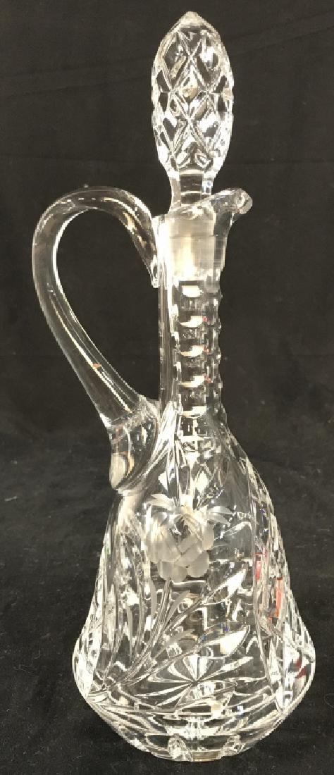 Cut Crystal Pitcher W Stopper: Pitcher is cut crystal. Contains frosted floral and leaf detail. Cut Crystal Pitcher, Crystal Pitcher, Cut Crystal Decanter, Crystal Decanter, barware, floral decanter. Measures approx 12.5 inches tal
