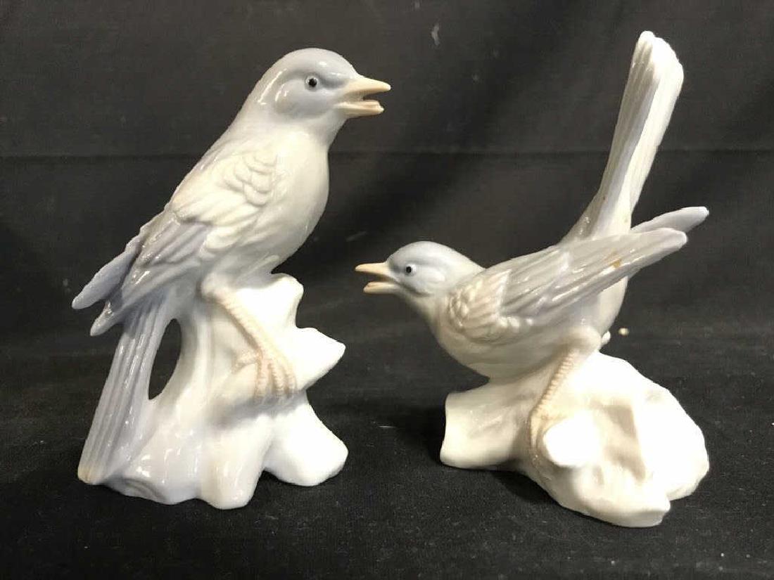 Lot 2 Porcelain Bird Figurals: Lot includes 2 porcelain bird figurals. Pieces are light blue and white toned. Taller piece measures approx 4.5 inches tall 3 inches deep. Animal statuary, bird figurals, decor pieces, home decor 6.