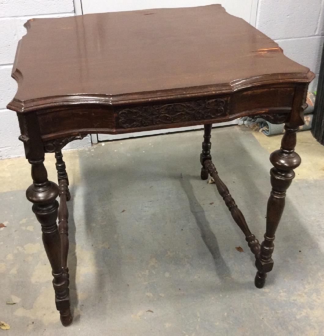 Vintage Carved Wooden Square Side Table: Vintage carved wooden square table / side table. Light wood with dark wood stain / paint. Floral carved detailed trims. Curved edge details. Table has moderate surface peeling and some cracks along bo