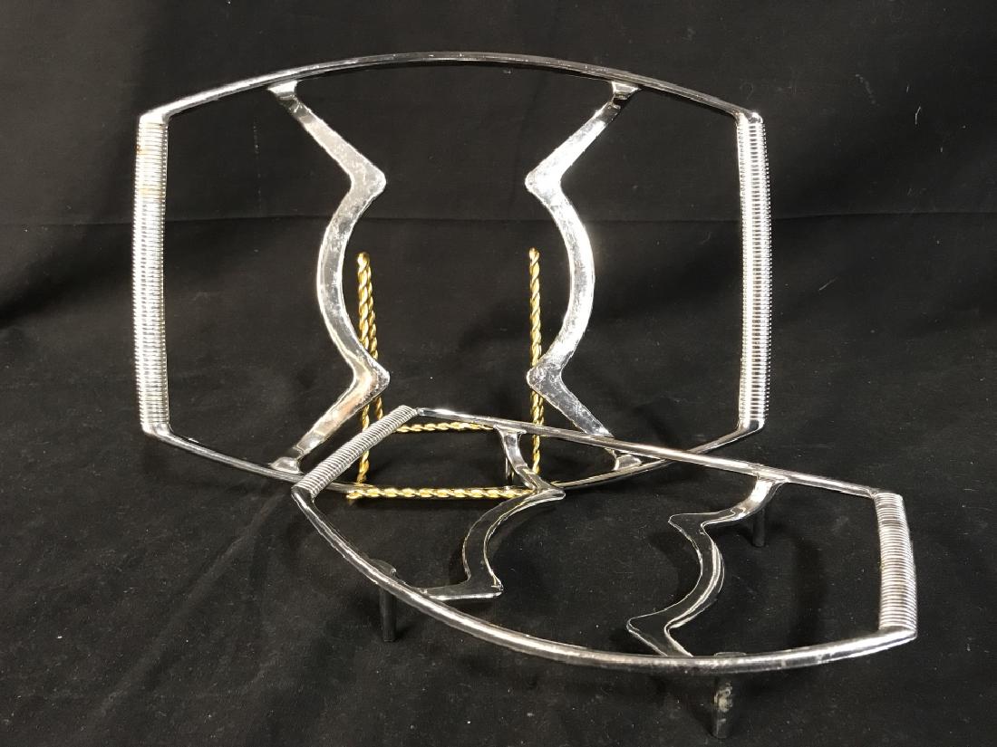 Set of 2 Silver Toned Corning Ware Metal Trivets: Set of 2 Silver Toned Corning Ware Metal footed Trivets, marked Corning Ware, larger one measures 13 1/2 x 9 3/4in, Good condition, Silver toned Serving Ware, Corning Ware, Kitchenware, 5