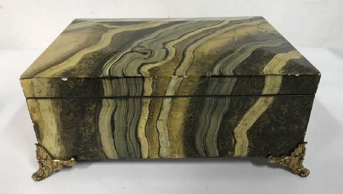 MAITLAND SMITH Keepsake Box: Gilded scrolled feet support tones of browns and gold in swirled mallachite / imitating the look of natural stone style, labeled for MAITLAND Smith, labeled for hand painted box possibly wood with glo