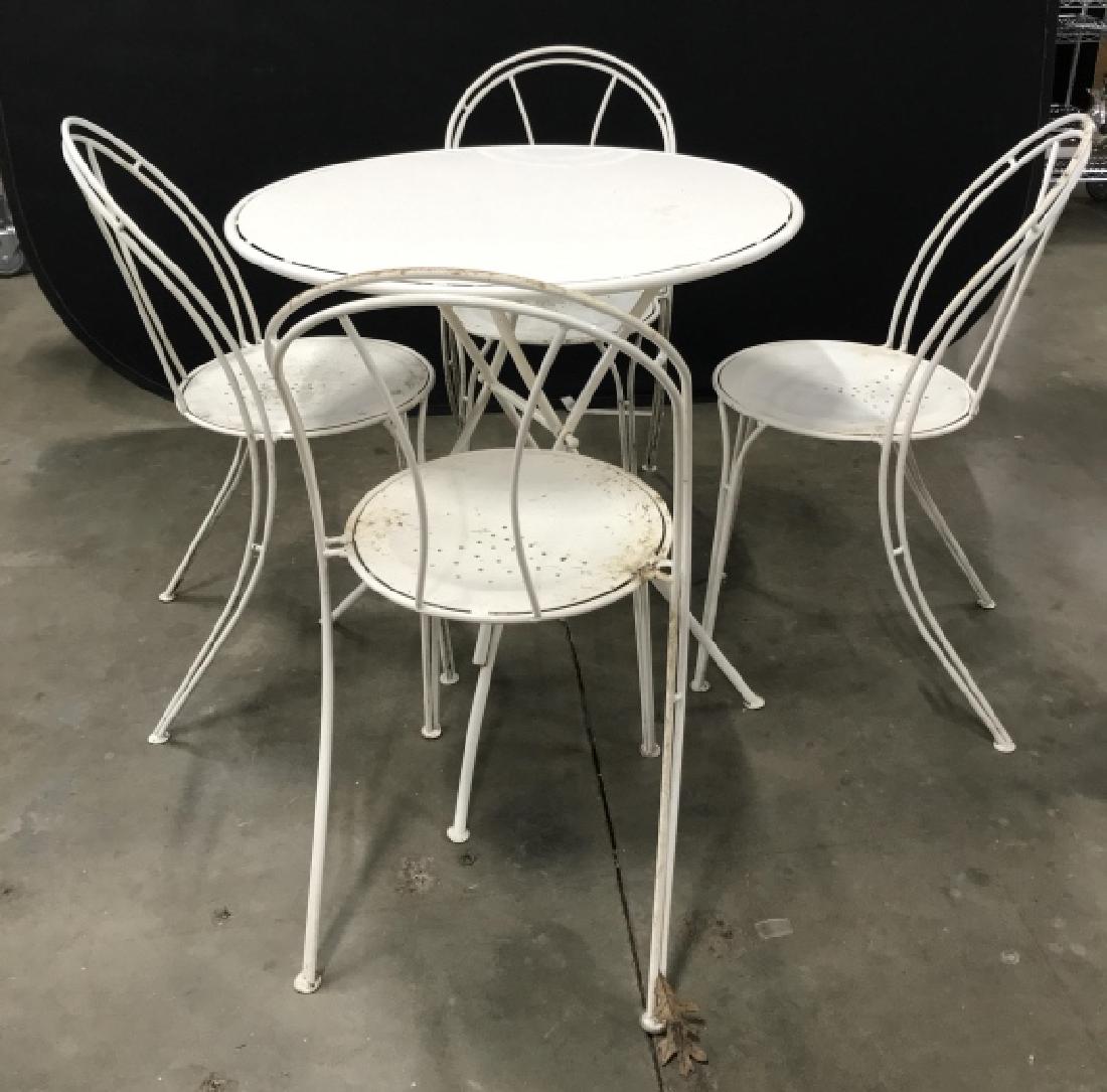 Set 5 White Toned Metal Table And Chairs: Set 5 White Toned Metal Table And Chairs, four chairs and one circular table , some scratches, needs cleaning, and slight rusting, Table Measures approx 29 inches tall x 29.5 inches in diameter. Garde
