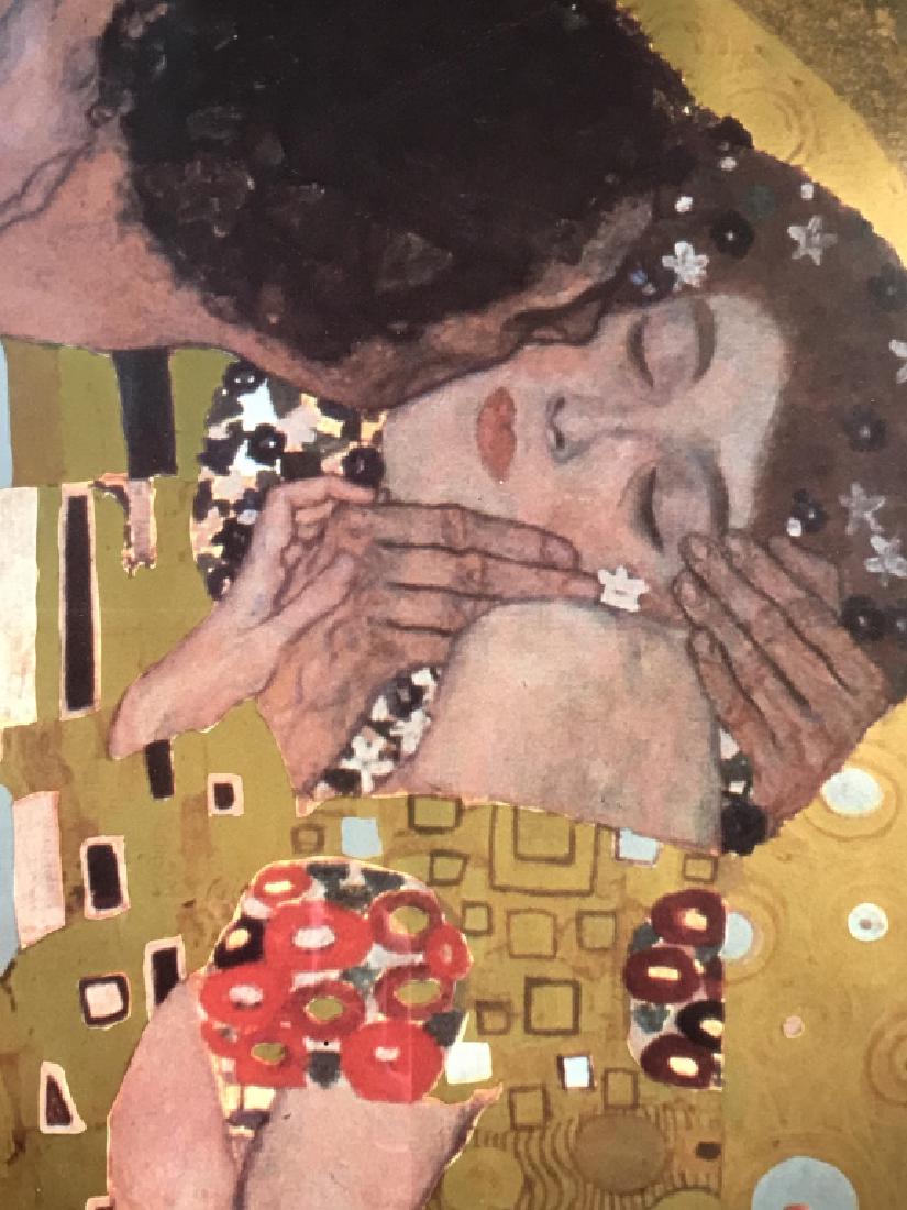 Framed Poster Print Of Klimt’s ‘The Kiss’: Framed poster print of Gustav Klimt’s ‘The Kiss.’ Print is double matted and in wood frame. Measures approx 33.5 inches in height by 26.25 inches in width with frame. Some rippling in paper, mig