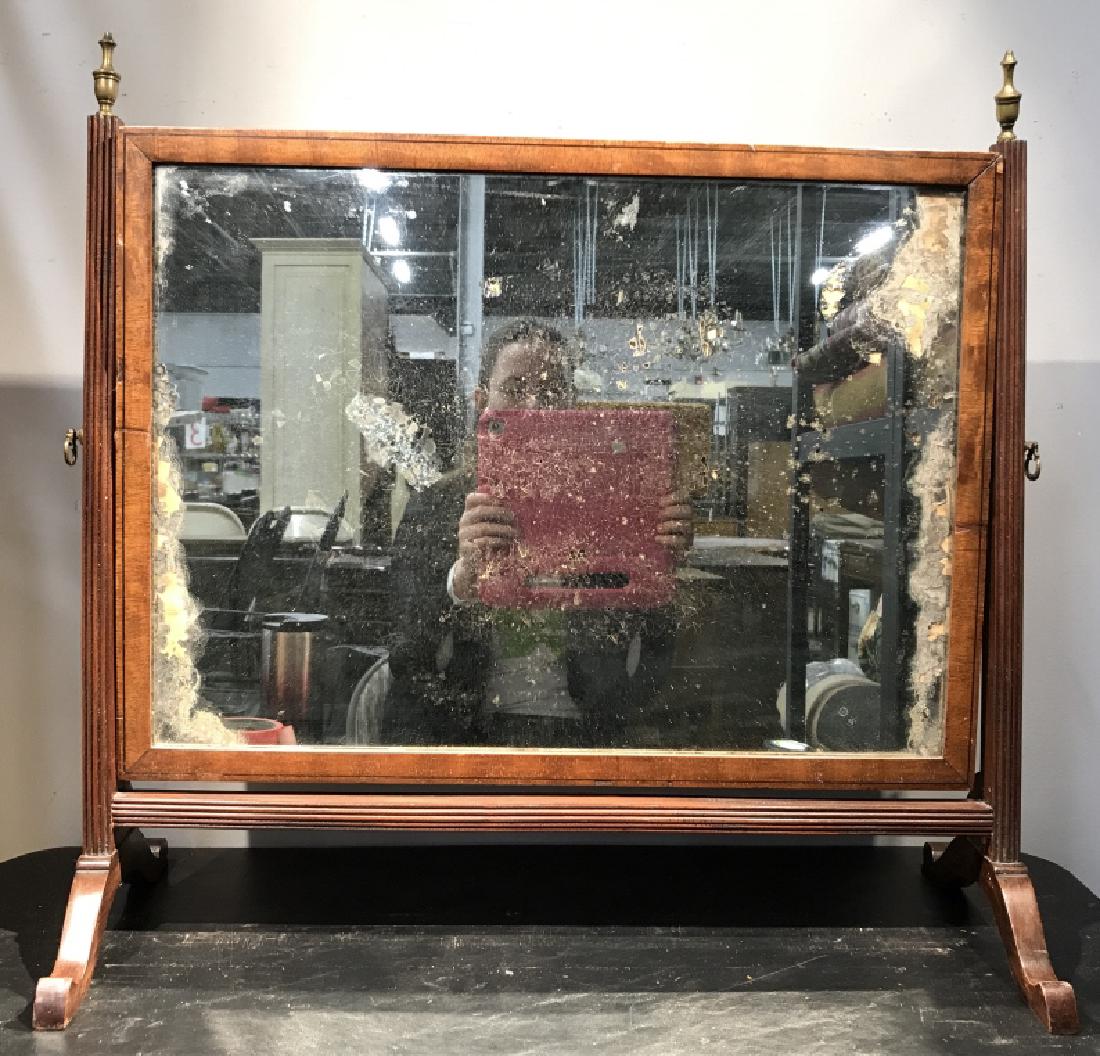 Antique Style Vanity Tilting Mirror On Stand: Antique style tilting mirror on stand. Wood frame and stand. There is moderate surface wear of mirror, might need replacement. Some surface wear to wood. Measures approx 24 inches in height by 25 inch
