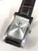 White Metal and Brown Leather Wristwatch