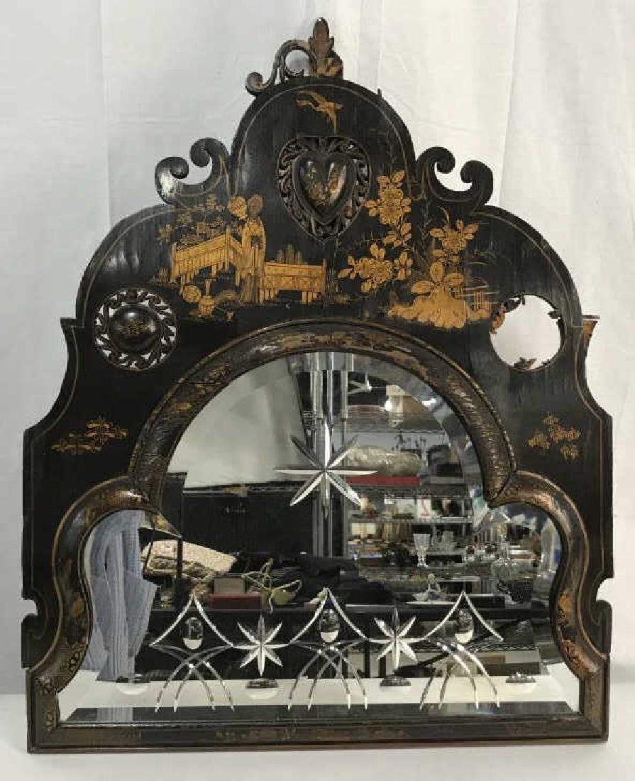 Chinoiserie Asian Style Wall Mirror: Vintage, possibly antique, Chinoiserie Asian style Black Lacquer Wall Mirror with parcel gilding of figures and patterns. Wood frame has surface wear due to age, might need restoration. Some pieces ar