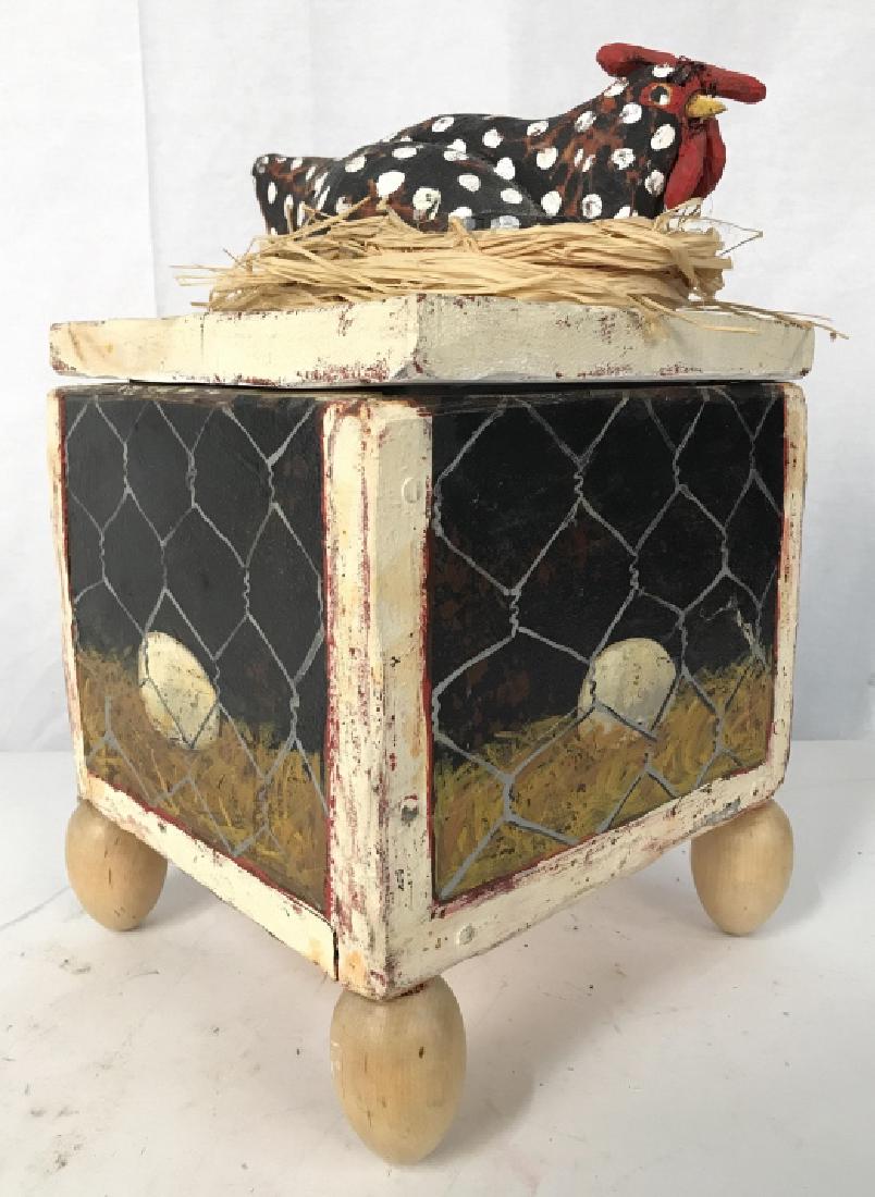 Folk Art Signed Jim Lambert Egg Laying Chicken: Folk Art Signed Jim Lambert Egg Laying Chicken Box resting on egg shaped legs, outer panels of box depict eggs behind chicken wire, interior of box is painted in a turquoise background with pink swirl