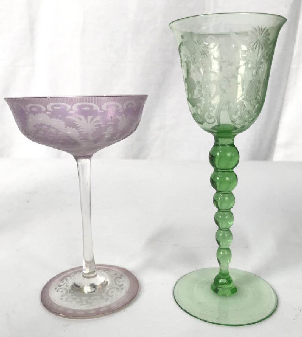 Lot 2 Poss Antique Etched Wine Champagne Glasses: Lot 2 Vintage Poss Antique Etched Wine Champagne Glasses, one glass is lavender in tone with cut to clear intricate design, second glass is green toned with etched design depicting male and female fig