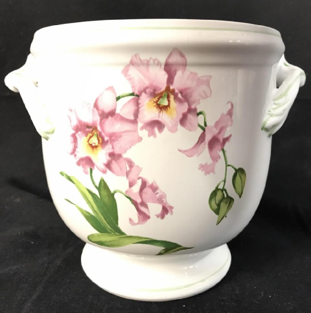 PORTA Footed Porcelain Floral Detailed Planter: Underside reads ORCHIDS BABARA WILSON PORTA RAUL DA BERNARDA PORTUGAL. Piece painted has floral detail with tones f green, pink, yellow, & orange. Measures approx 6 inches tall 8 inches wide with hand