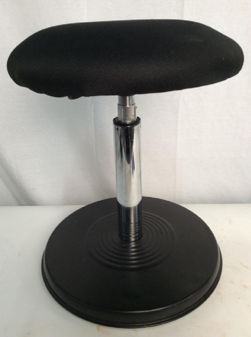 Black Toned Upholstered Adjustable Stool: Stool is black toned. Stool has adjustment lever for height adjustment. Base is black toned and metal. Music stool, piano stool, drafters stool, Measures approx 18.5 inches tall 15 inches wide. Proper