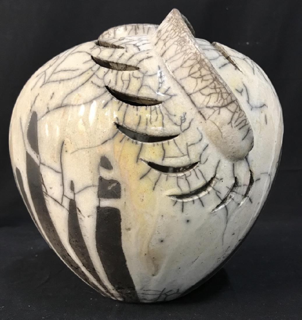 Signed Contemporary Ceramic Vessel: Signed Hand Made Contemporary Ceramic Vessel, cream toned glazed background, open work design and black toned lined design in glaze, measures approximately 9.5 inches tall x 9 inches in diameter, Sign