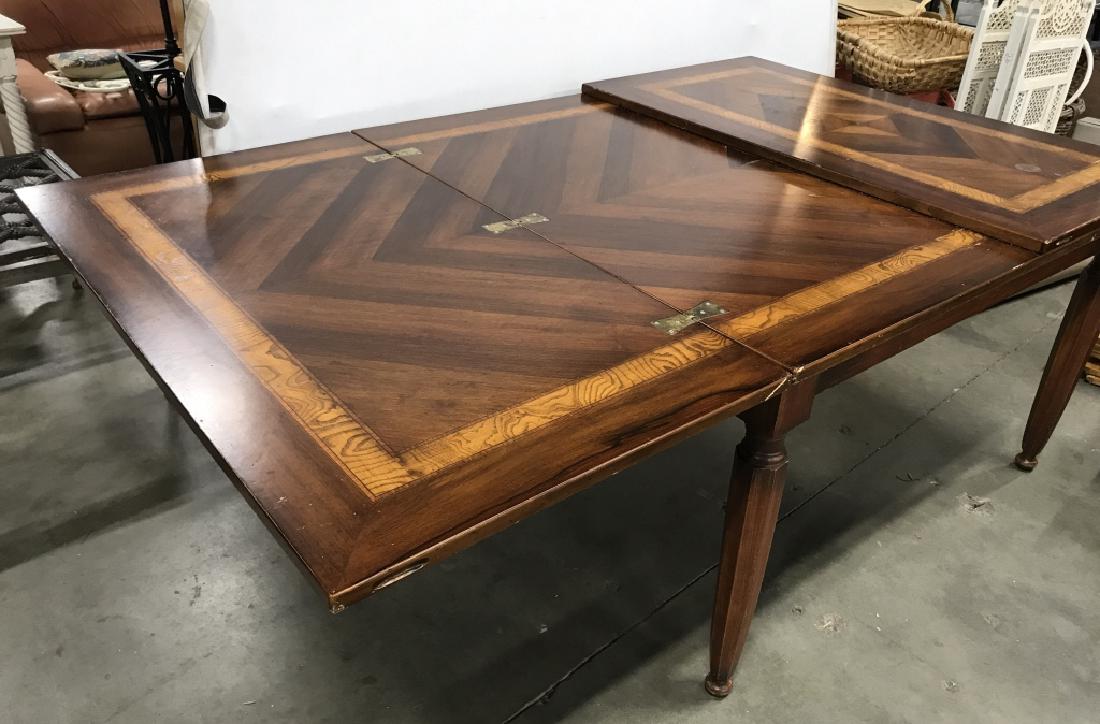 Antique Mahogany Flip Top Dining Table W Marquetry: Antique mahogany flip leaf top, bifold dining table with marquetry, parquetry, inlay. Table has two leaves that flip open to extend length of table. Table has surface wear, might need minor restoratio