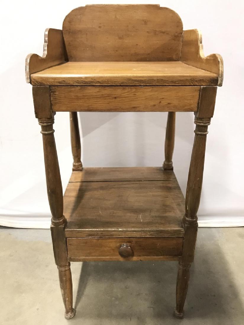 Antique Carved Wooden Wash Stand Table: Antique Wash Stnd, Pine Wood, Washers Table is wooden. Contains 4 carved wooden legs. Lower half has drawer with knob style handle. Measures approx 37 inches tall 16 inches wide and deep. In antique c