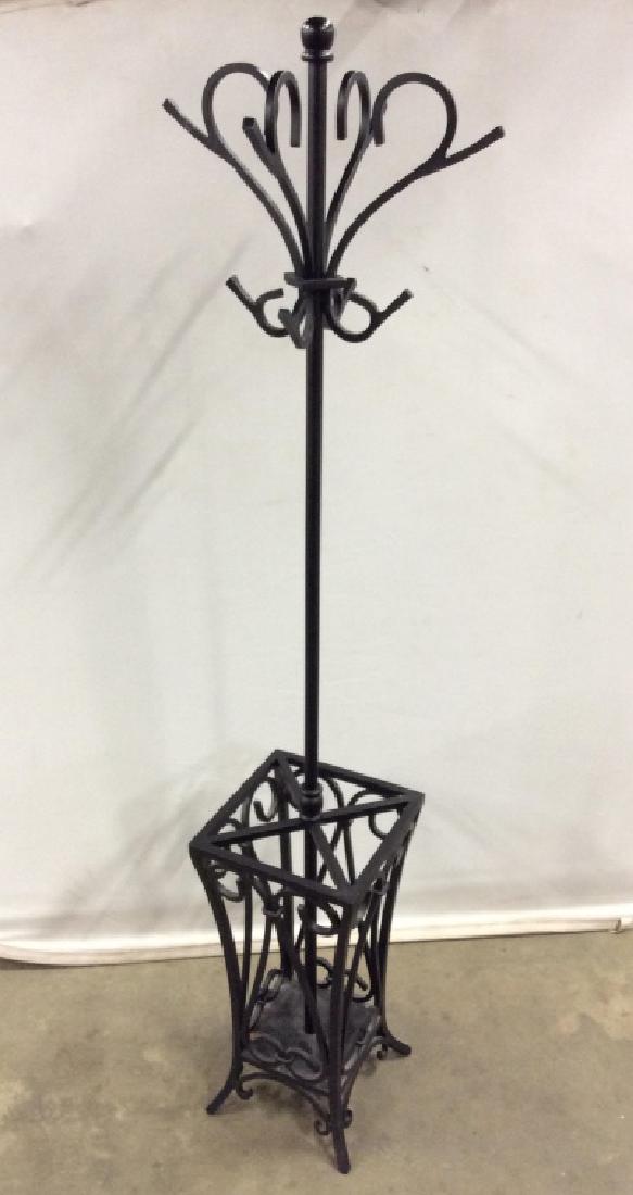 Metal Coat Tree W Umbrella Rack: Metal coat tree with umbrella rack basket. Possibly iron metal with black tone finish. Measures approx 67.5 inches in height by 11.25 inches squared in width and depth. Entryway decor, coat rack, coat