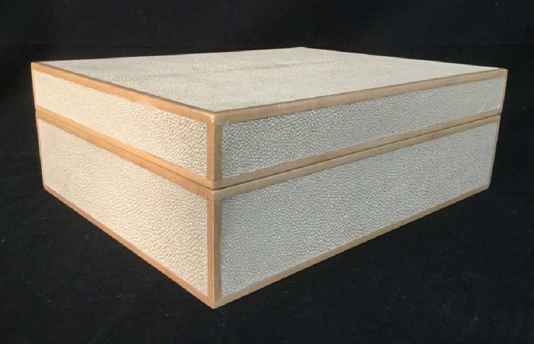 Large Shagreen Style Box W Light Wood Trim Details: Cream tone Shagreen Style Box with light wood trim details. Hinged lid opens to cream tone soft suede style lining. Marked on underside for Plantation Design. Measures approx 4.5 inches in height by 1