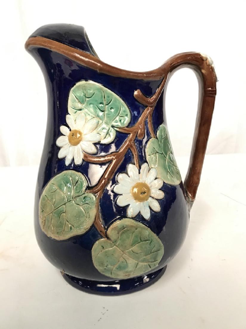 Early Daisy Majolica Jug Vessel: Numbered underside, Ceramics, Pottery, earthenware, rich blue under glaze with greens browns whites daisies and vines, short pedestal foot, jug, pitcher, vase, tableware, Arts and Crafts, Decorative A