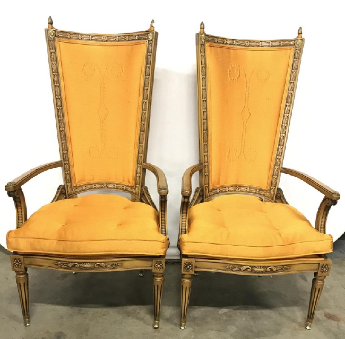 Pair Orange Upholstered Wooden Dining Chairs: Dining chairs have orange melon tone. Each piece has intricately carved wooden detail. Tops of backrests have gold toned finials. Backrest has detail in upholstery. Seat cushions are Tufted. Has flora