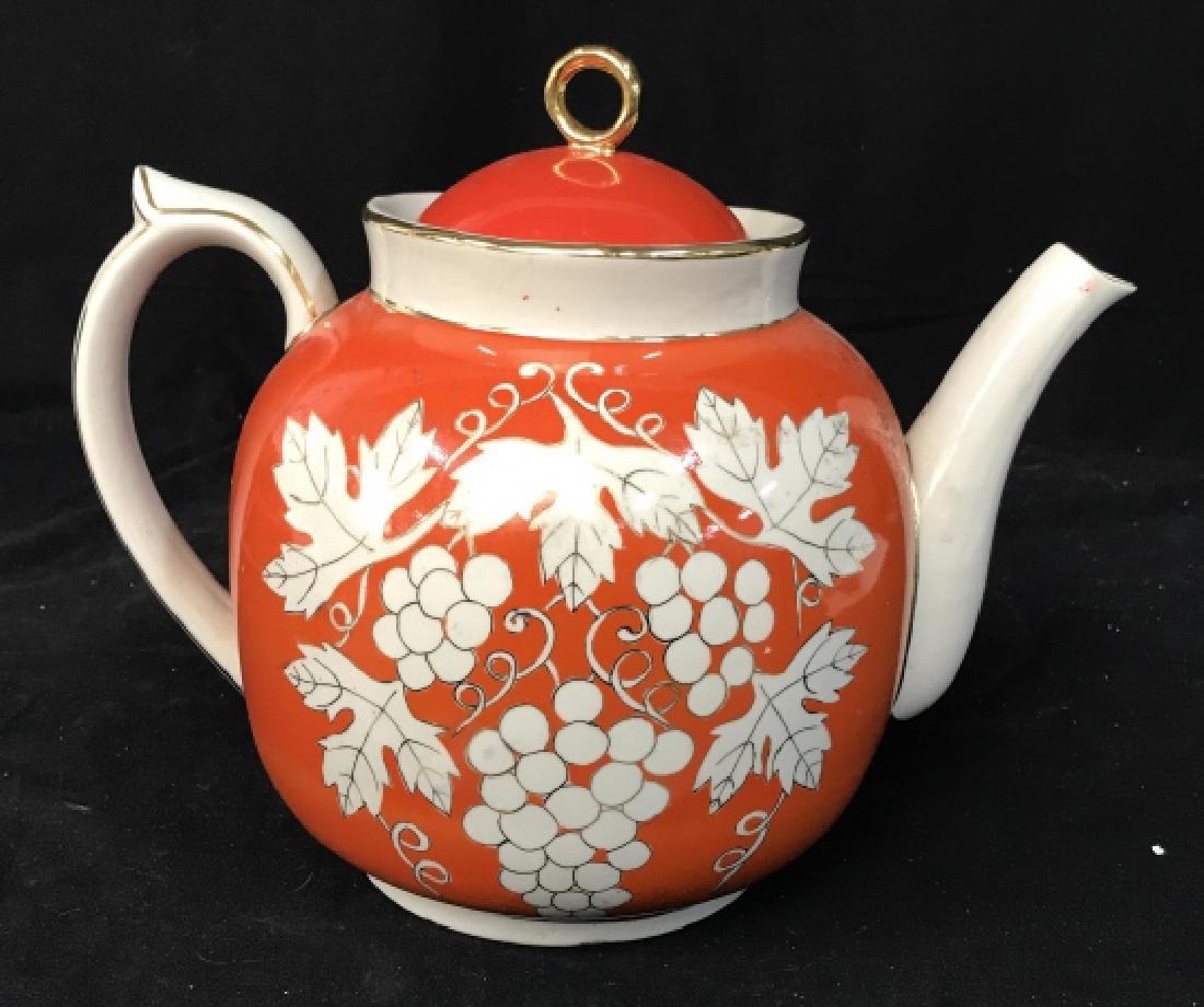 Signed Extra Large Asian Porcelain Tea Pot: In deep tangerine tone with gold accents white grapes and leaves, Signed and trademarked underside, Asian decorative arts, orientalist, orientalia, tableware, decorative accessory, tea pot, vessel vas