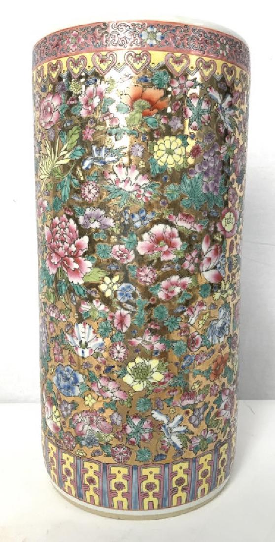 Asian Porcelain Umbrella Stand: Asian Porcelain Umbrella Stand with multicolored floral and leaf motif with gold toned painted background, no condition issues noted, measures approximately 17.5 inches tall x 8.5 inches in diameter. 