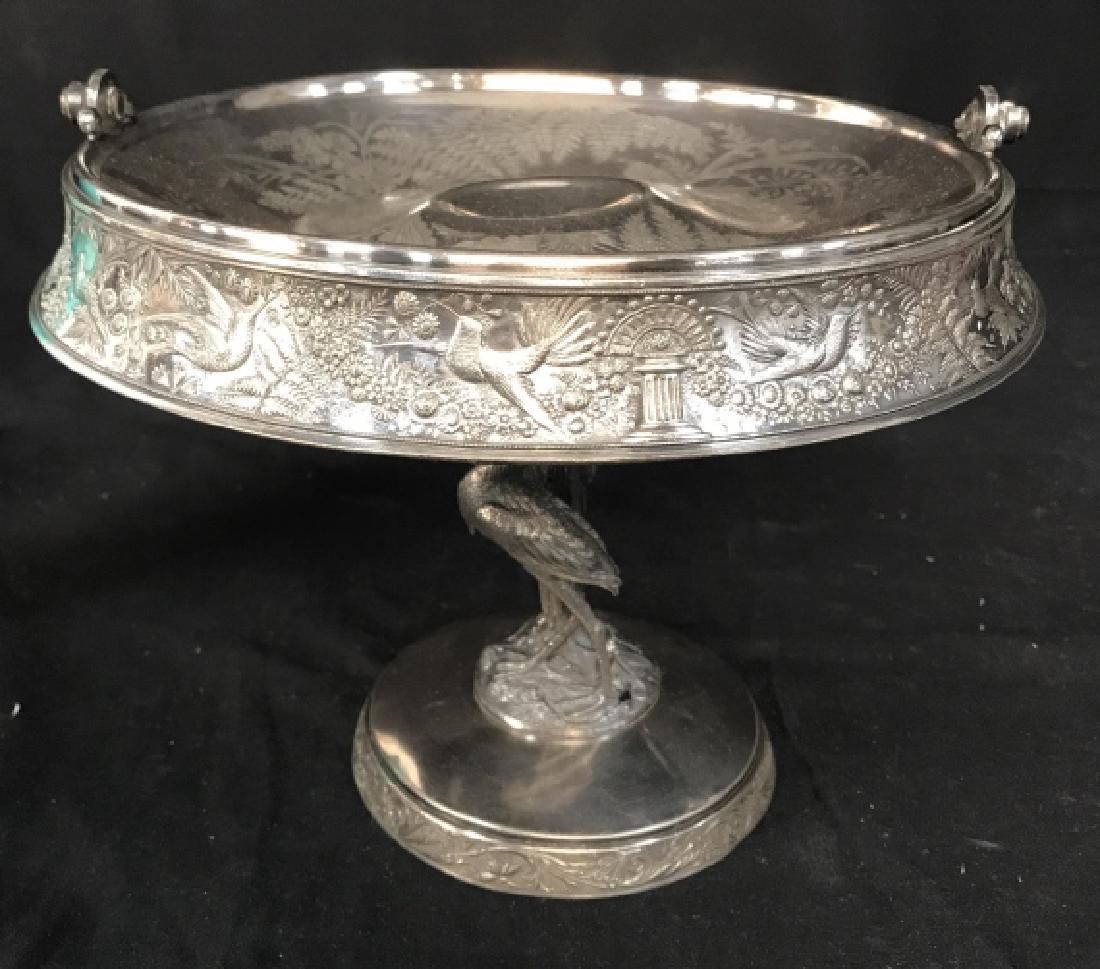 Meriden B Silver Plate Heron Footed Brides Basket: Meriden B Company Silver Plated Brides Basket Cake Stand, basket interior is decorated with an etched pattern of ferns, grasses and flowers surrounding central round depression. The outer edge of the 