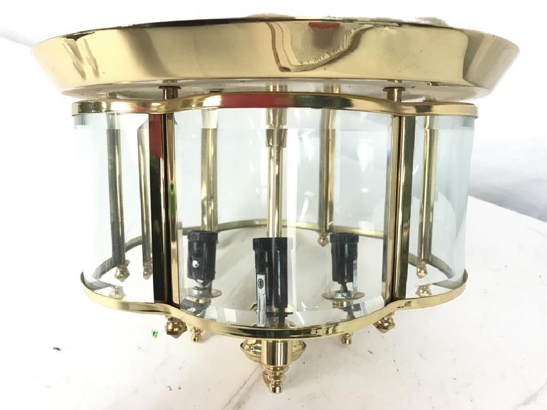 Gold Toned Metal & Glass Ceiling Light: Piece is has gold toned Metal frame and top. Has curved glass inserts around piece. Measures approx 8.5 inches tall, 10 inches wide. Home accent, ceiling fixture, lighting accessory 6.