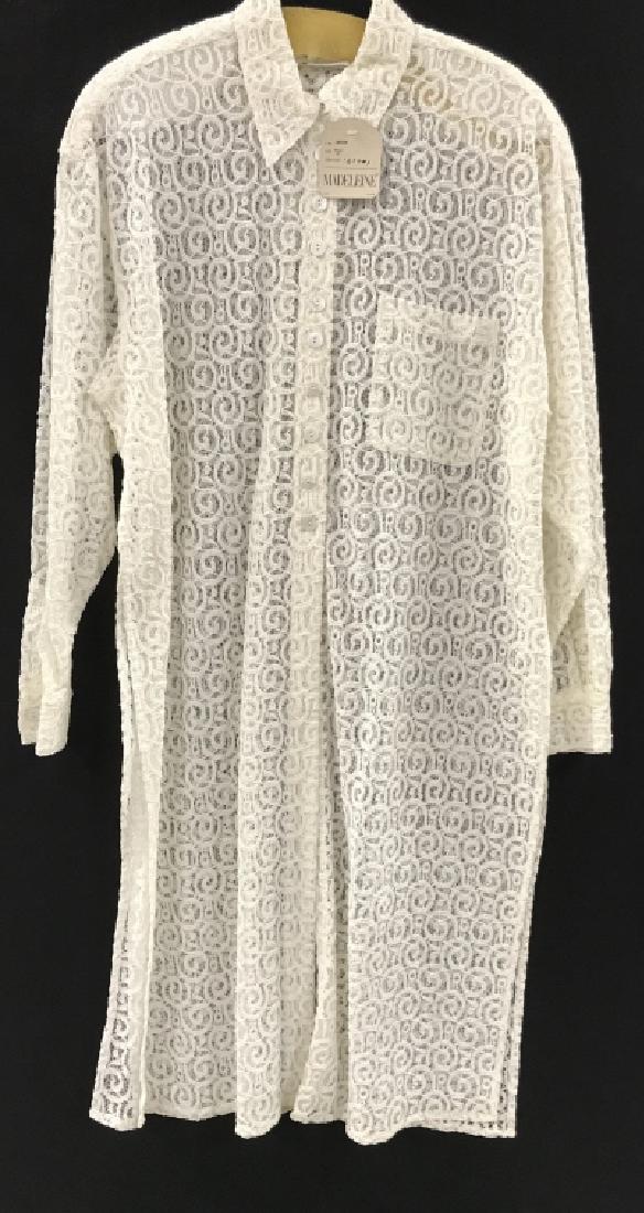 MADELEINE Designer Lace Duster Jacket: MADELEINE designer lace duster jacket. Jacket is white in tone with button closure. Label reads for Madeleine, Size 38 / 40 M. Comes with original tag. Some minor blemishes, might need spot cleaning. 