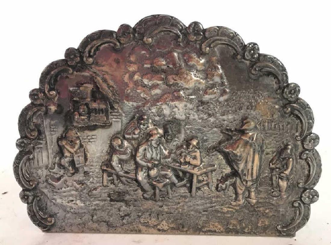 Silver Toned Intricate Metal Napkin Holder: Underside appears to be marked ZIPLADO. Piece is silver toned and metal. Possibly sterling. Measures approx 5.5 inches long 4 inches tall. Contains intricate ornate detail around edges and beveled det