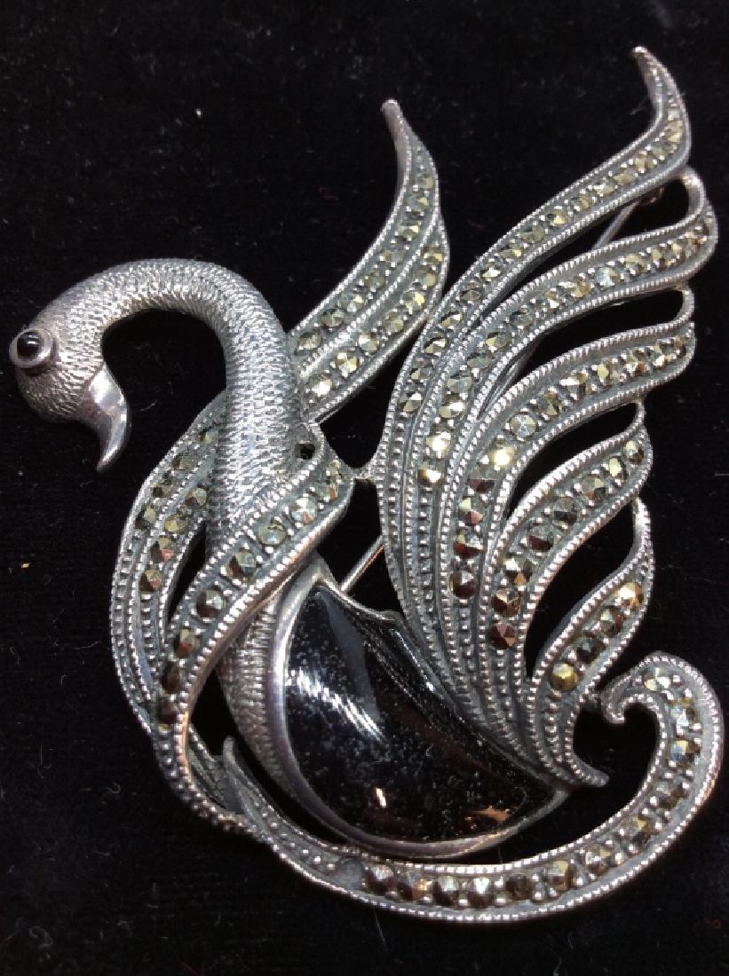 Sterling Silver Marcasite And Onyx Swan Pin: Sterling silver brooch pin with onyx center cabochon and marcasite details, marked in reverse as 925, measures app 3 in by 2 in. Women’s vintage estate jewelry, fashion accessories, wearable accesso