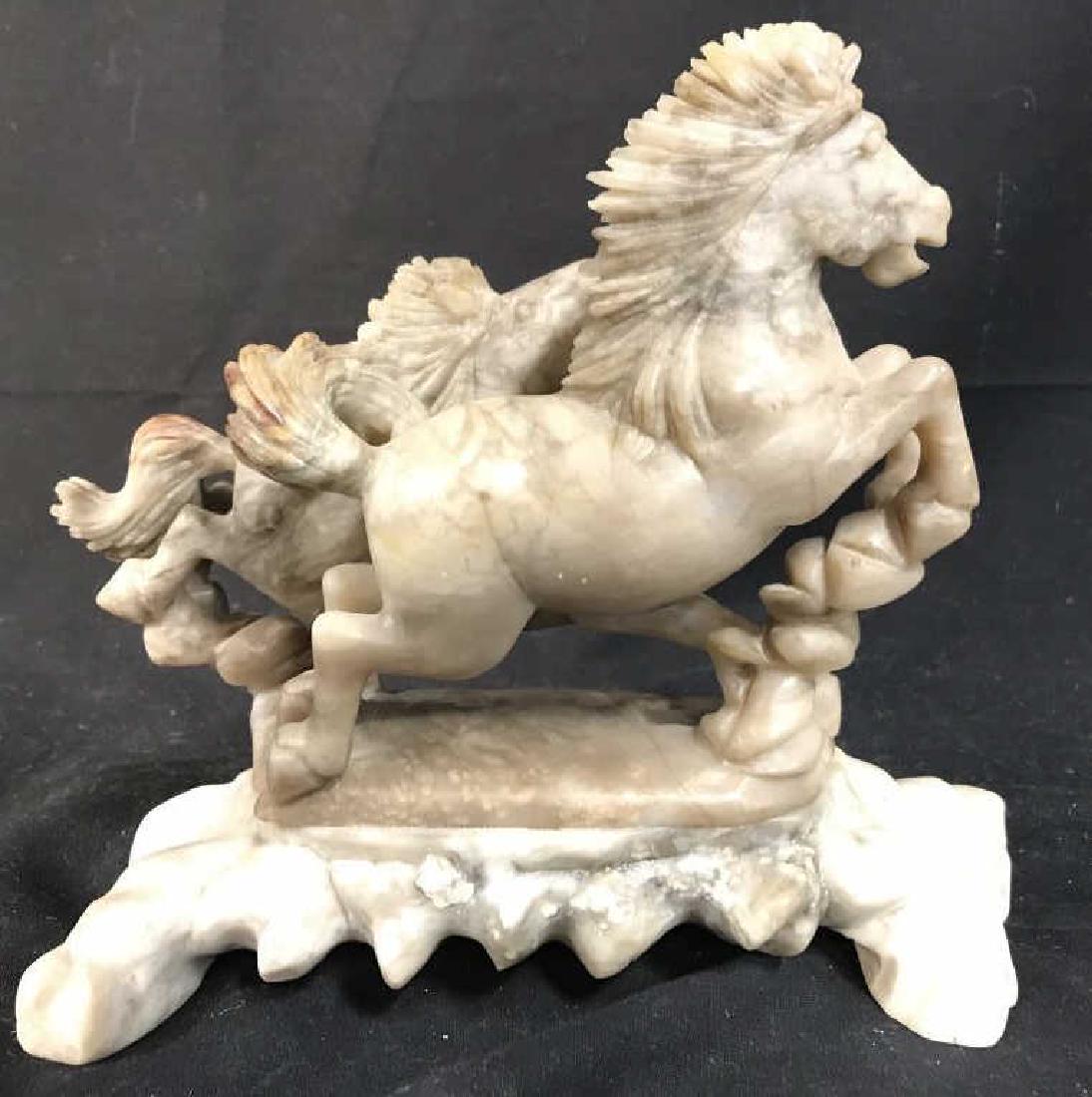 Chinese Soapstone Figurine Of Horses: Soapstone Sculpture is cream toned, piece depicts 2 horses galloping side by side. Piece Measures approx 8 inches long, 7 inches tall 3 inches deep. Soapstone Sculpture, horse sculpture, horse figure,